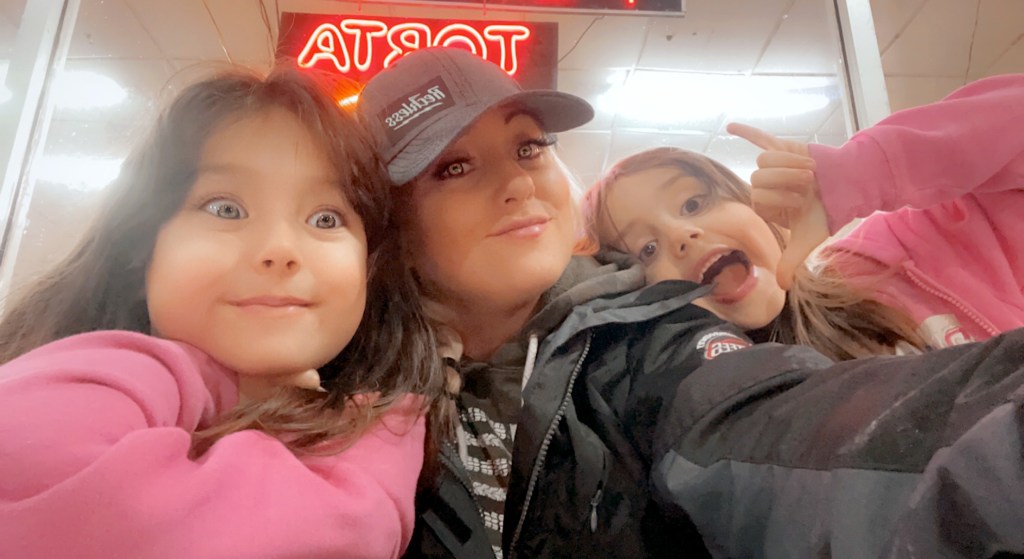 Woman writing about healing from grief and emotional burnout after death of husband. (pictured: woman and children of late husband)